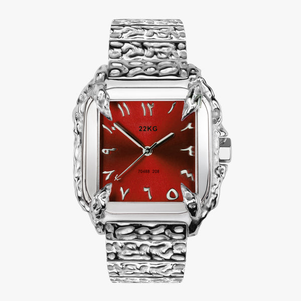 Silver 22KG CANINE watch with a red face  arabic on a white background